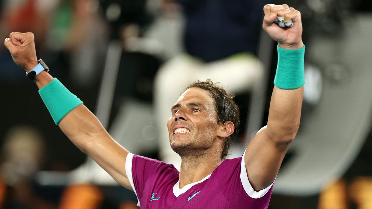 Spain's Rafael Nadal celebrates after winning the men's singles semi-final match against Italy's Matteo Berrettini on day twelve of the Australian Open tennis tournament in Melbourne on January 28, 2022. (Photo by Martin KEEP / AFP)