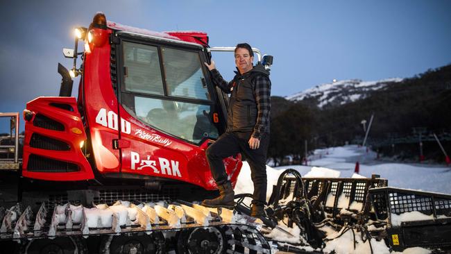 Slopes manager Shane Macleod ploughs on snow at Friday flat, Thredbo, on Sunday. Picture: Sean Davey.