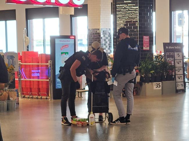 The photos appears to show police officers searching a woman’s grocery bag. Picture: X