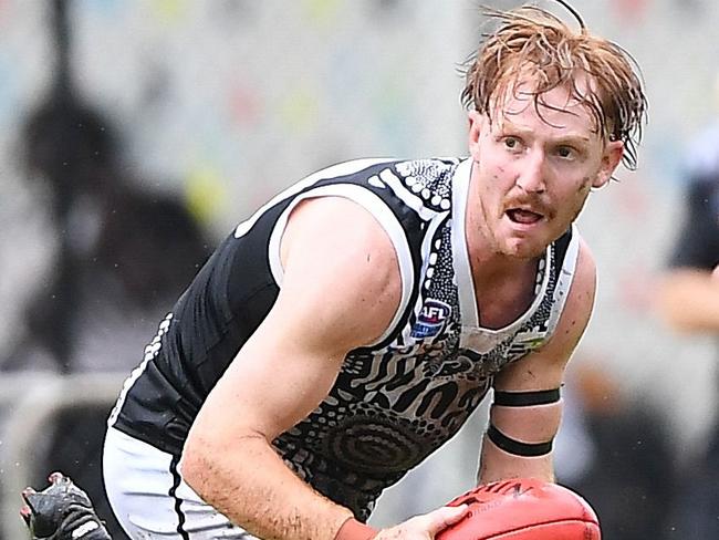 Palmerston's Eric Guthrie looks for a disposal option. Picture: Felicity Elliott/AFLNT