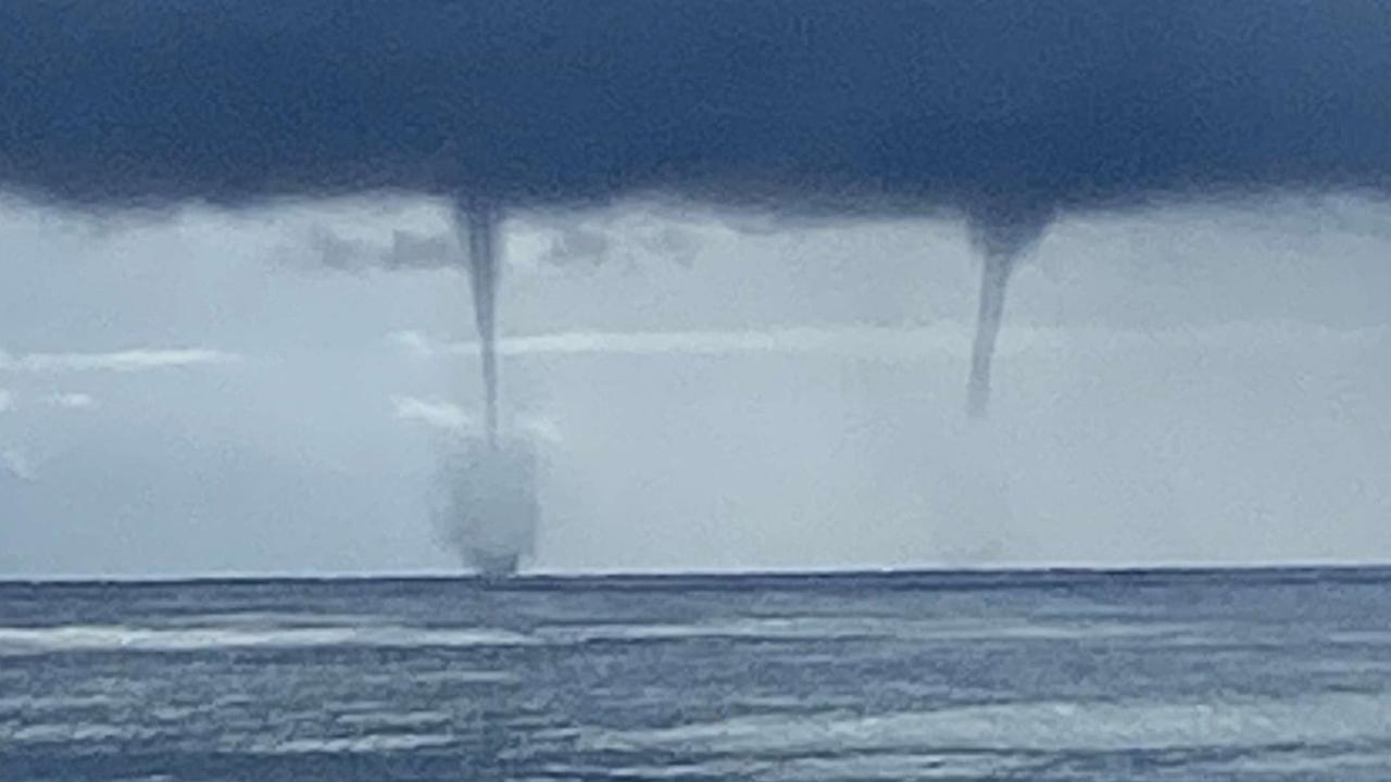 93mm in one hour: Water spouts whipped up as slow-moving system dumps on SEQ