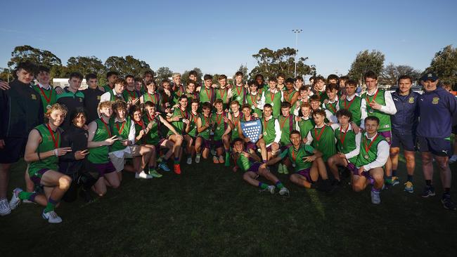 Parade College’s 2023 senior and intermediate Herald Sun Shield premiership teams celebrate.