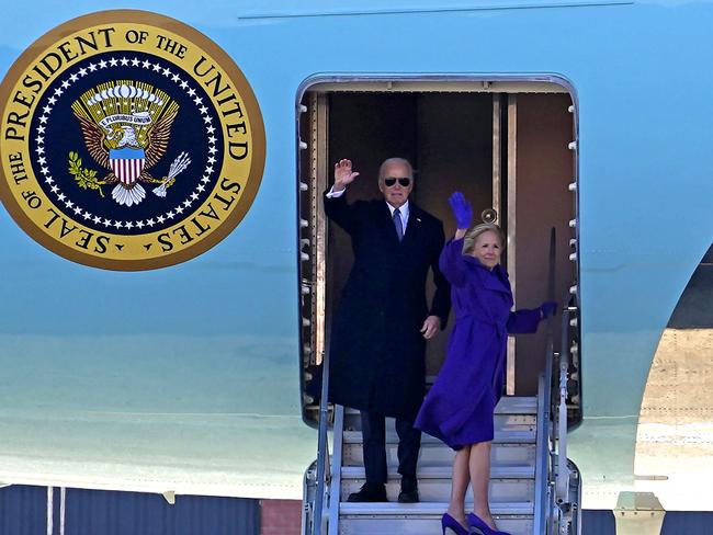 TOPSHOT - US former President Joe Biden and former First Lady Jill Biden wave as they board Air Force One at Joint Base Andrews, Maryland, during a farewell ceremony on January 20, 2025, following Donald Trump's inauguration. (Photo by Allison ROBBERT / AFP)