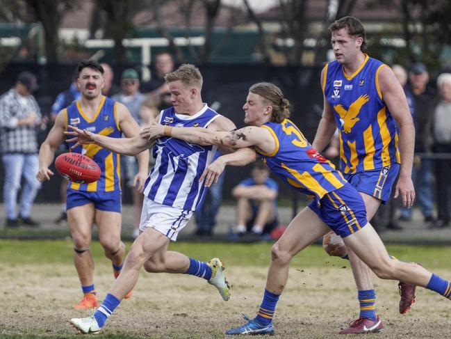 Chad Mulvogue boots Langwarrin forward.