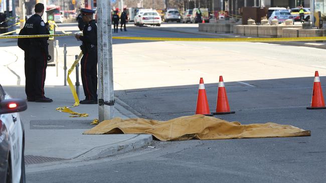 A man drove a white rental van into a crowd of pedestrians in the centre of Canada’s biggest city Toronto on Monday afternoon, killing 10, police said. Picture: AFP/Lars Hagberg