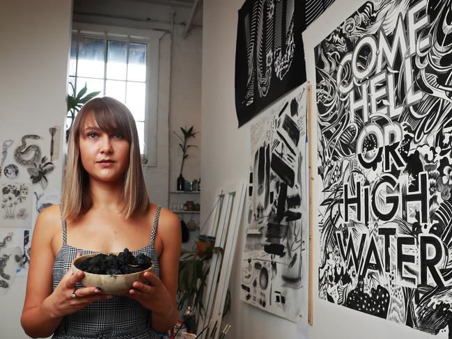 10/3/20: Sydney-based artist, Gemma O'Brien, in her Redfern studio. A new exhibition to open on Thursday will showcase the work of local and international artists using charcoal from the recent Australian bushfires as their medium. John Feder/The Australian.