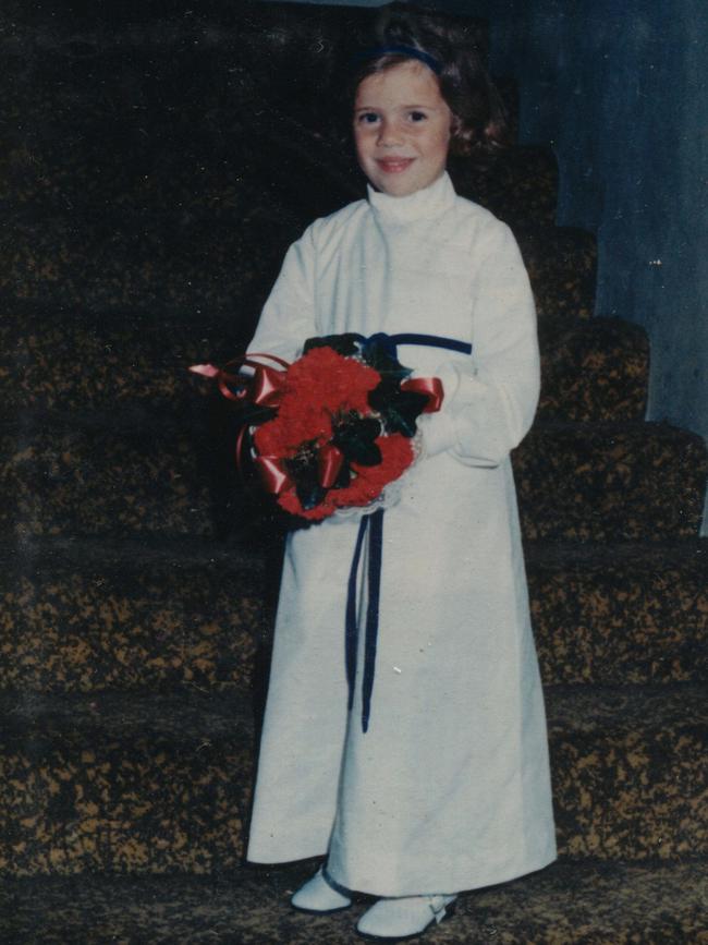 Kathleen as a flower girl at a wedding.