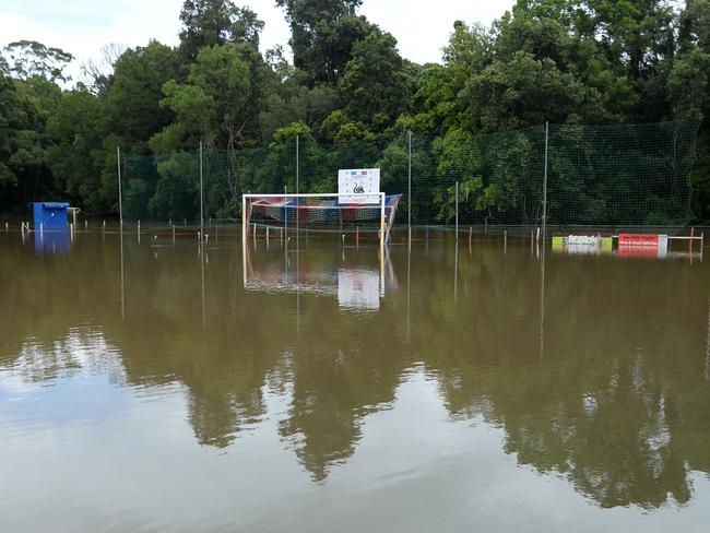 A football field is covered in floodwater in Woombye on the Sunshine Coast, Thursday, February 13, 2020. More than 200 millimetres of rain have fallen in the area since yesterday, causing floods. (AAP Image/Dan Peled) NO ARCHIVING