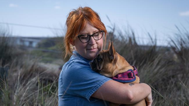 Breast cancer survivor Kate Thomas with her French Bulldog Bronco at Torquay. Picture: Brad Fleet