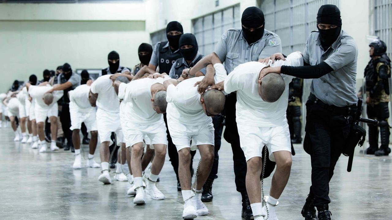 A row of the prisoners being marched towards their cells. Picture: El Salvador’s Presidency Press Office/AFP