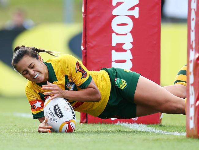 SYDNEY, AUSTRALIA - NOVEMBER 22:  Corban McGregor of Australia dives to score a try during the Women's Rugby League World Cup match between the Canadian Ravens and the Australian Jillaroos at Southern Cross Group Stadium on November 22, 2017 in Sydney, Australia.  (Photo by Mark Nolan/Getty Images)