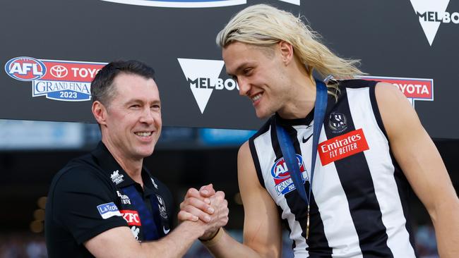 MELBOURNE, AUSTRALIA - SEPTEMBER 30: Craig McRae, Senior Coach of the Magpies and Darcy Moore of the Magpies celebrate during the 2023 AFL Grand Final match between the Collingwood Magpies and the Brisbane Lions at the Melbourne Cricket Ground on September 30, 2023 in Melbourne, Australia. (Photo by Dylan Burns/AFL Photos via Getty Images)