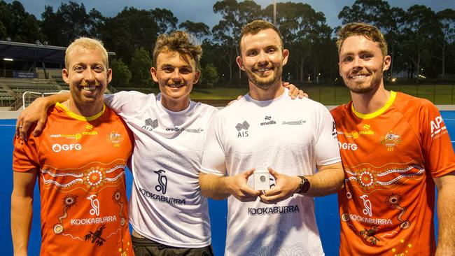 Townsville junior Mitch Nicholson (holding pin) with Queensland players Corey Weyer, Tim Howard, and Jayden Atkinson. Picture: Andrew Wiseman (Instagram: @wisemansport).