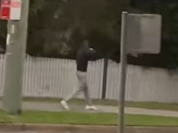 A youth, filmed by a resident, walking in Newport with a hoodie pulled over his face, after he allegedly threw eggs at nearby homes. Picture: Supplied (Facebook)