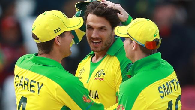 Man of the match Nathan Coulter-Nile (centre) is congratulated by Alex Carey (left) and Steve Smith after Australia’s victory over the West Indies at Trent Bridge. Picture: Getty Images