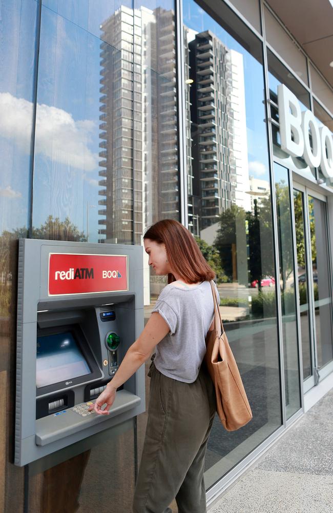 A woman uses an ATM. Picture: AAP/file/Sarah Marshall