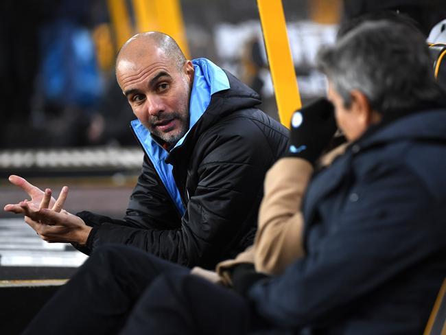 WOLVERHAMPTON, ENGLAND - DECEMBER 27: Pep Guardiola, Manager of Manchester City in conversation prior to  the Premier League match between Wolverhampton Wanderers and Manchester City at Molineux on December 27, 2019 in Wolverhampton, United Kingdom. (Photo by Shaun Botterill/Getty Images)