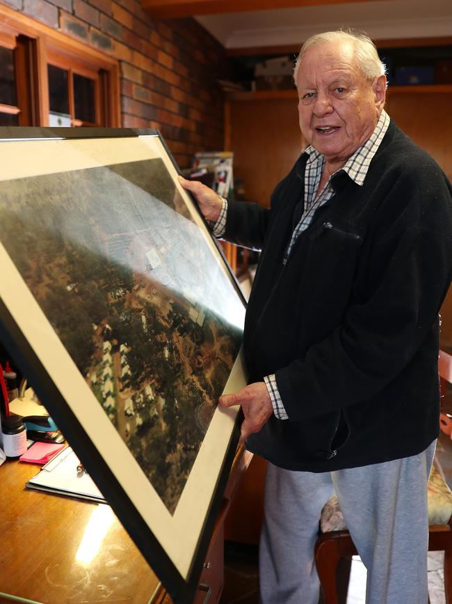 “There were a lot of tears. I feel like crying just talking about it,” says John Crooke, holding a picture of his old town. Picture: Peter Wallis