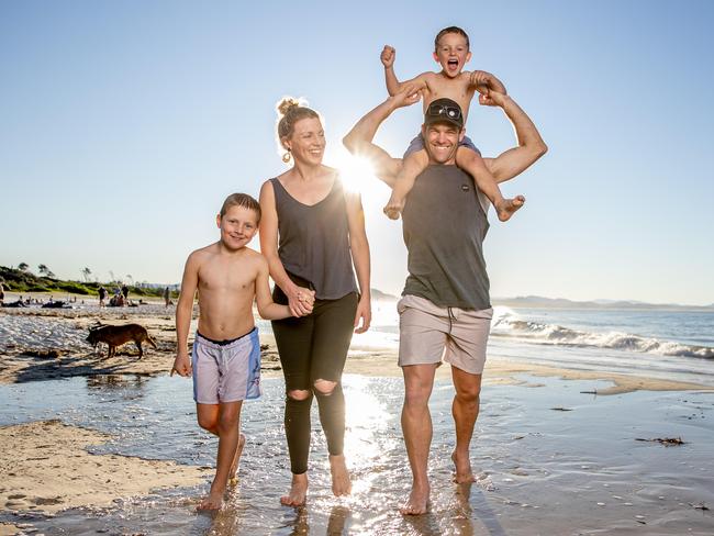 Brett and Jocelyn Williams with kids Mack, 6, and Jax, 8, at Main Beach in Byron Bay. Picture: Luke Marsden