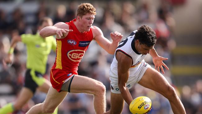 Top draft pick Matt Rowell only played sparingly for the Suns, but showed good signs. Here he hunts Crow Ben Davis. Picture: AFL Photos