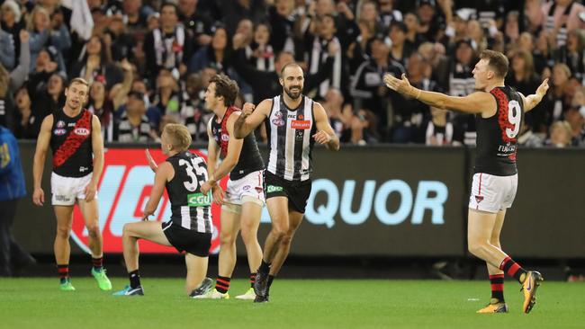 Collingwood's Steele Sidebottom celebrates a goal while Brendon Goddard looks on. goal. Picture: Alex Coppel. 