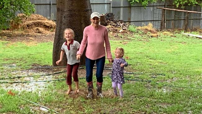 Erika, Larissa and Annie Petfield jumping in puddles and celebrating the rain. Picture: contributed