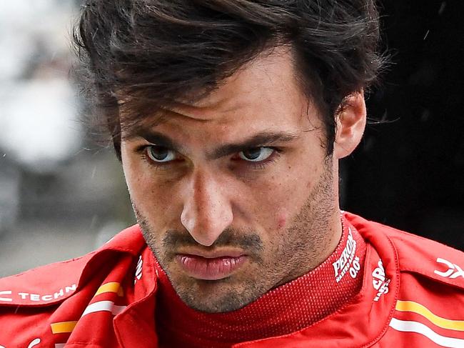 Ferrari's Spanish driver Carlos Sainz Jr. walks during the second practice session ahead of the Formula One Japanese Grand Prix race at the Suzuka circuit in Suzuka, Mie prefecture on April 5, 2024. (Photo by Toshifumi KITAMURA / AFP)