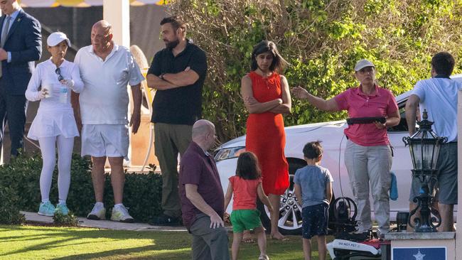 US Vice President-elect JD Vance (R), his wife Usha Chilukuri Vance (C) and their children with the new US Secret Service robot dog at Mar-a-Lago. Picture: AFP.