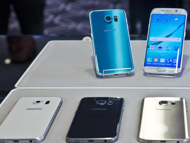 All colours, shapes and sizes ... The Galaxy S6, top left, and Galaxy S6 Edge, to right, are on display with choice of color selections at a special media preview in New York.