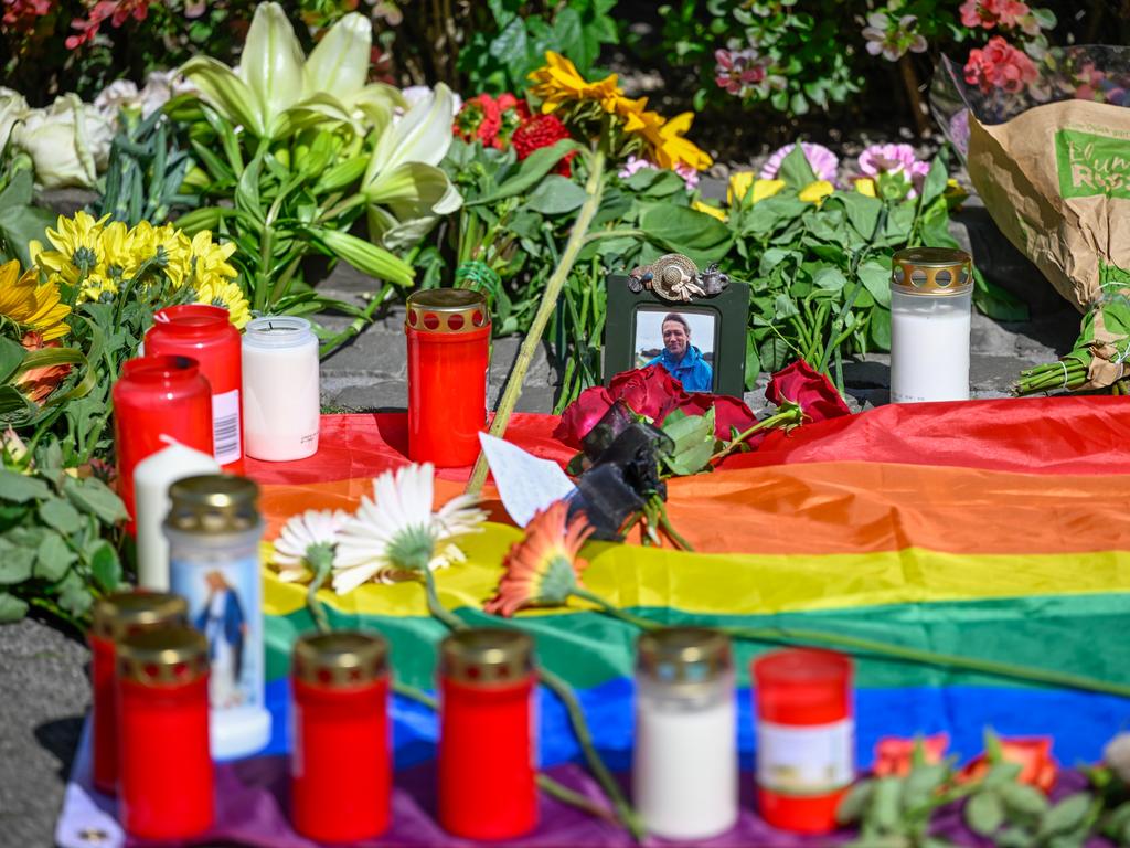 Flowers, candles and tributes are placed close to the site of the tragedy. Picture: Sascha Schuermann/Getty Images)