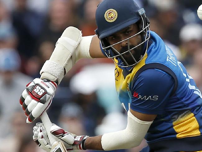 TOPSHOT - Sri Lanka's Lahiru Thirimanne bats during the 2019 Cricket World Cup group stage match between Sri Lanka and Australia at The Oval in London on June 15, 2019. (Photo by Ian KINGTON / AFP) / RESTRICTED TO EDITORIAL USE