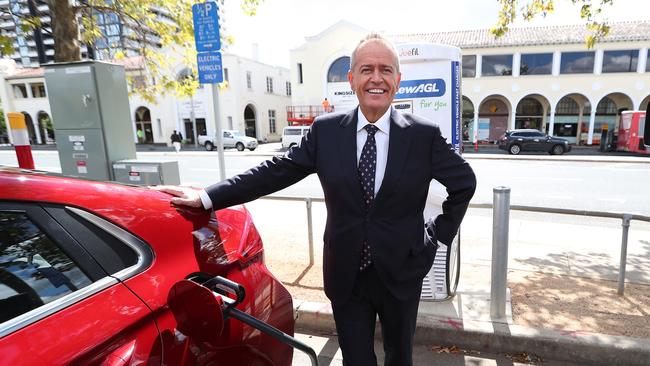 The Leader of the Opposition, Bill Shorten charging an electric car at the launch of Labor's Climate Change Action Plan at ACTEWAGL Electric Car Charging Station in Canberra.. Picture Kym Smith