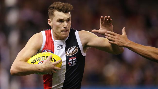 Blake Acres tucks the ball under his arm against the Crows. Picture: Michael Klein.