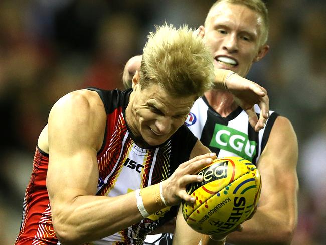 Jack Frost gives Nick Riewoldt a clip over the head after he marks. Picture: Wayne Ludbey