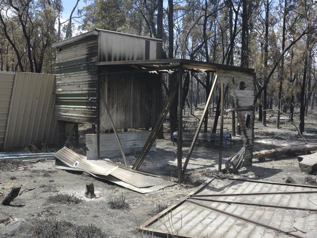 Photos: Fire zone reveals devastation as cars, buildings destroyed