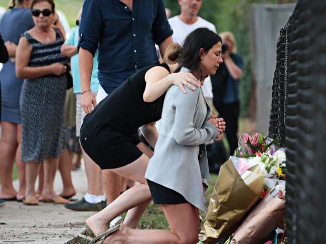 The children’s mother Leila Geagea says a prayer for her children. Picture: Adam Yip