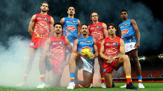 (Back L-R) Jy Farrar, Joel Jeffrey, Jed Anderson, Lloyd Johnston. (Front L-R) Malcolm Rosas, Ben Long and Sean Lemmens pose with the Gold Coast Suns AFL Indigenous Guernsey ahead of Sir Doug Nicholls Round. (Photo by Chris Hyde/Getty Images)