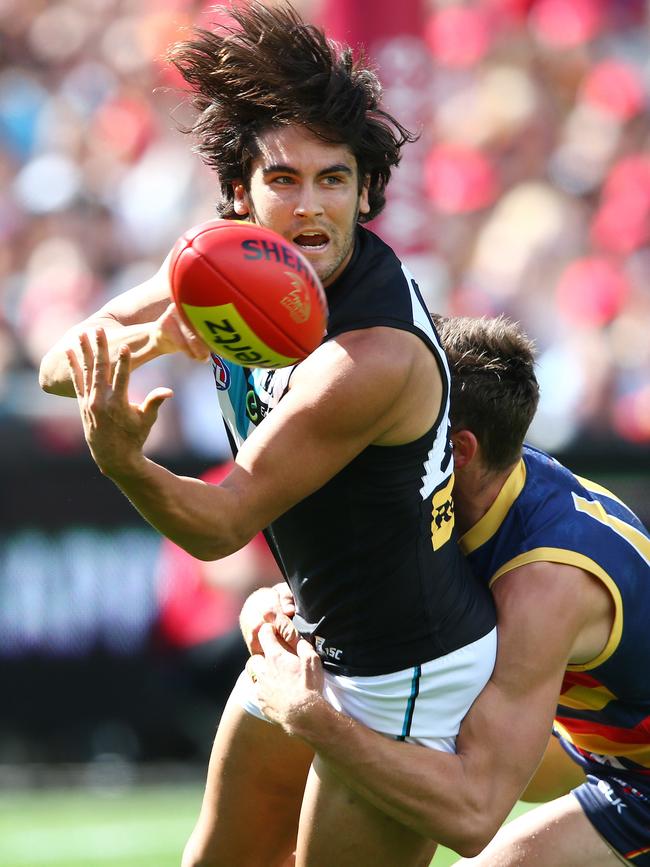 Chad Wingard is tackled by Paul Seedsman. Picture: Sarah Reed