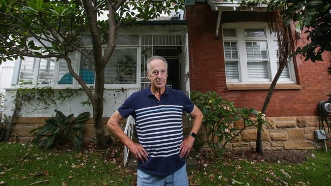 Coogee resident Bruce Hammond in front of his home. The Aquarius development runs behind his property.