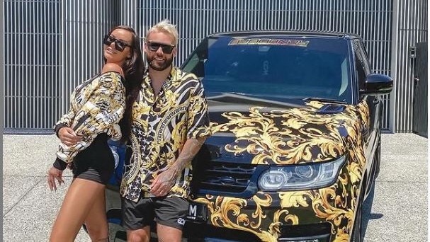 Police alleged Insta-famous Troy Williams, aka Troy Candy (pictured with fiance Anita Cassin) performed a burnout at Helensvale in November 2019.