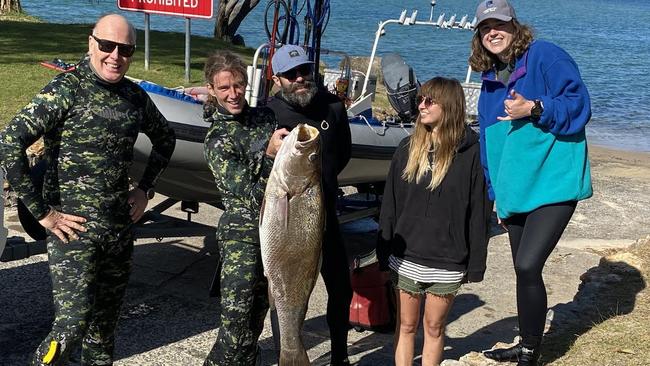 The Adreno team and Luke Purdie, 18, holding his 25kg jewfish that took him for a 50m ride.