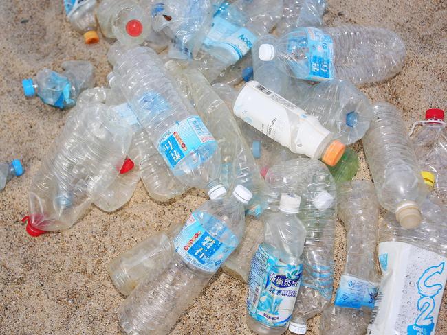 Coffs Harbour June 30th 2015Marine Science University Student Kelsey Bannister shares the concerns of the greater Marine Science community of the alarming risk to marine life due to the huge numbers of plastic bottles washing up on North Coast New South Wales at beaches such as Wooli Beach.Please note - This photo taken near the Marine Sciene Centre, Charlesworth Bay Coffs Harbour.Photo Frank Redward