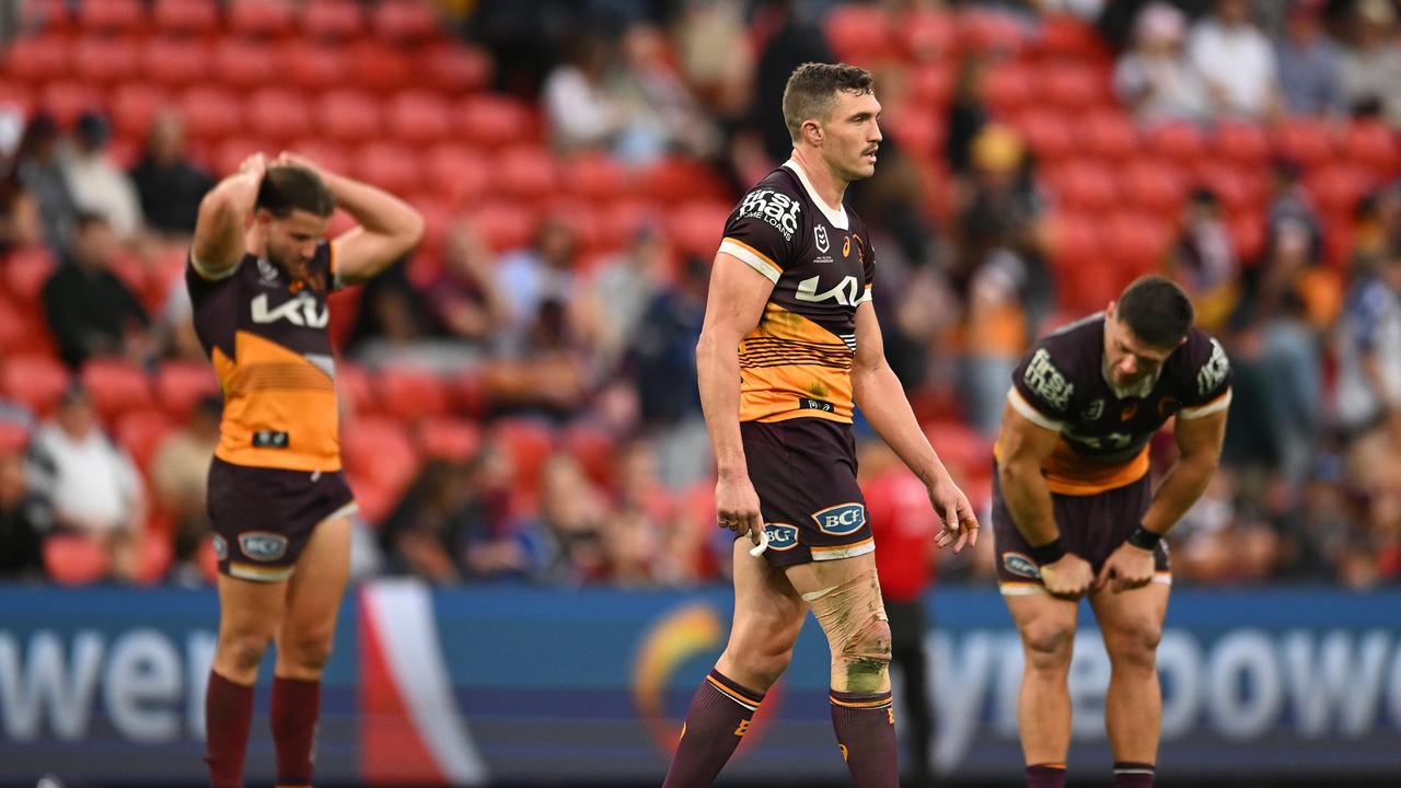 The Broncos react after the heavy defeat at Suncorp Stadium. (Photo by Albert Perez/Getty Images)