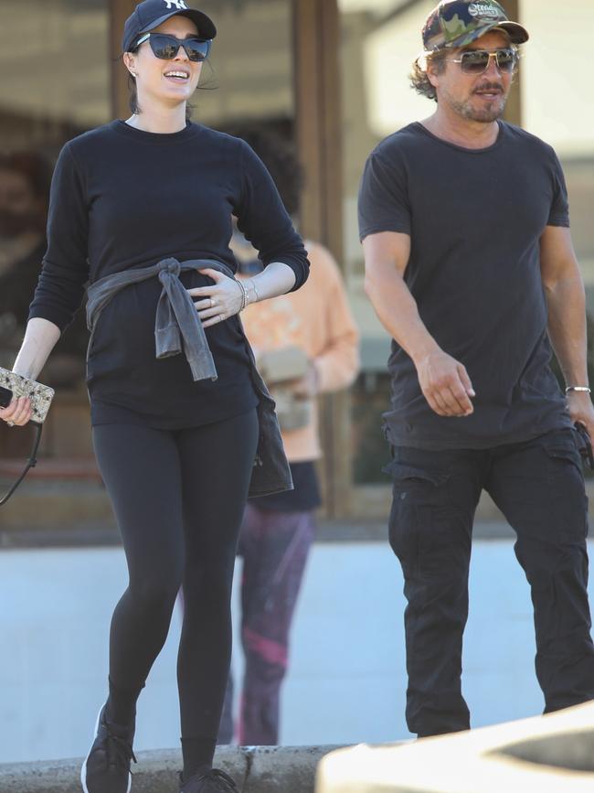 John Ibrahim and his pregnant fiancee Sarah Budge pictured enjoying a morning walk in Bondi. Picture: @khapgg / Backgrid