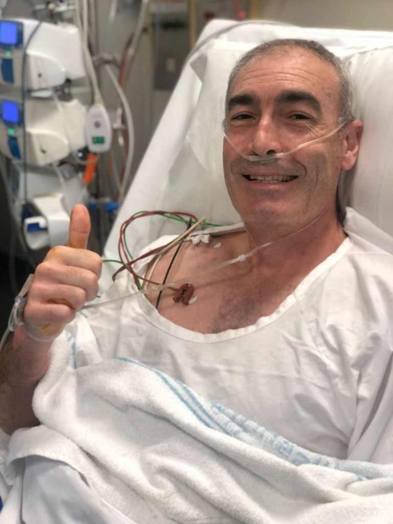 Greg Page recovering in hospital bed after his cardiac arrest during a bushfire concert.