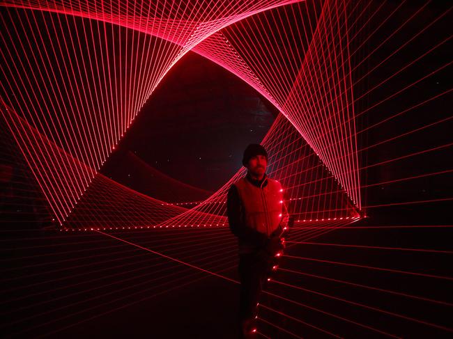 Artist Matthew Schreiber with his interactive laser installation <i>Leviathan</i>. Picture: NIKKI DAVIS-JONES