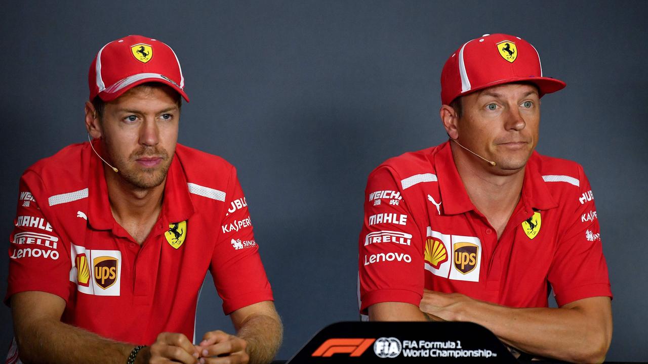Ferrari's German driver Sebastian Vettel (L) and Ferrari's Finnish driver Kimi Raikkonen look on as they address a press conference at the Autodromo Nazionale circuit in Monza on August 30, 2018 ahead of the Italian Formula One Grand Prix. (Photo by ANDREJ ISAKOVIC / AFP)