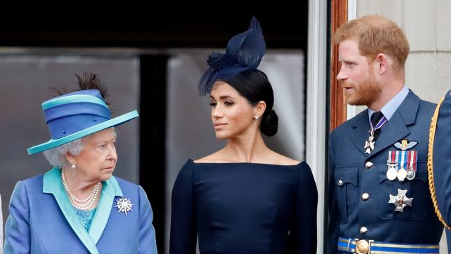 Queen Elizabeth II, Meghan, Duchess of Sussex and Prince Harry, Duke of Sussex at Buckingham Palace in 2018. Picture: Getty Images