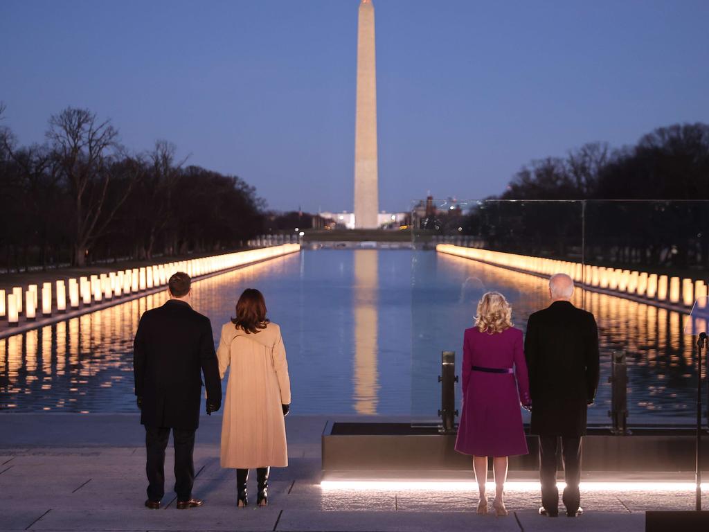 The future Vice-President (second from left) Kamala Harris and President Joe Biden (far right) at the memorial. Picture: AFP