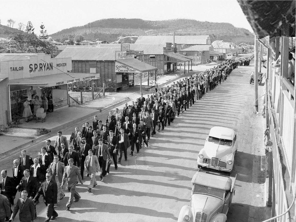 Mourners walk the streets to honour those who lost their lives in Collinsville. Picture: Fred Carew